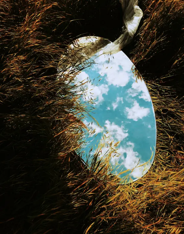 Reflective mirror symbolizing self-exploration in therapy